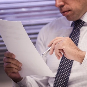 A business man reading a document