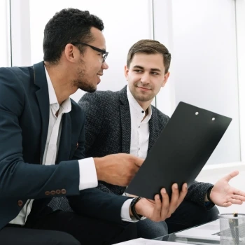 People sitting while talking in an office