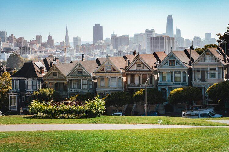 Victorian houses with city skyline