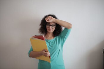 tired_adult_woman_with_papers