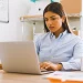 An office worker reading on laptop about how long does it take to form an LLC in New Hampshire