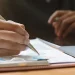 Man writing on paper about processing time for an LLC in Pennsylvania