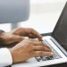 A man studying looking up an LLC in Alabama